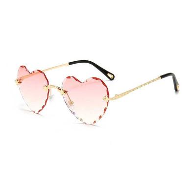 China New Fashion Sun Glasses Metal Love Sunglasses Frameless Heart Shaped Women for sale