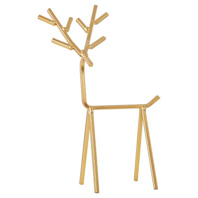 China Europe 2021 new style makeup table jewelry gold deer female hand stand form jewelry earring display stand for sale