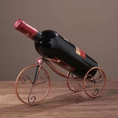 China Retro viable factory direct copper color metal wine rack, European iron art tricycle wine rack, living room wine cabinet decorations for sale