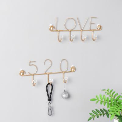 China Creative Nordic Light Luxury Iron Viable Crystal Hook Minimalist Central Institute of Statistics Wall Decoration Storage Finishing Coat Hook Home for sale