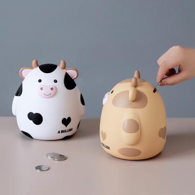 China Eco-friendly material of the new creative cute cartoon cow shape piggy bank children's birthday gift desk decoration ornaments resin crafts for sale