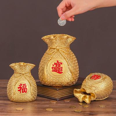 China Chinatown Creative Chinese Luxury Home Decor China Ornaments Lucky Bag Gold Coin Gold Bag Form New Year Gifts Resin Crafts for sale