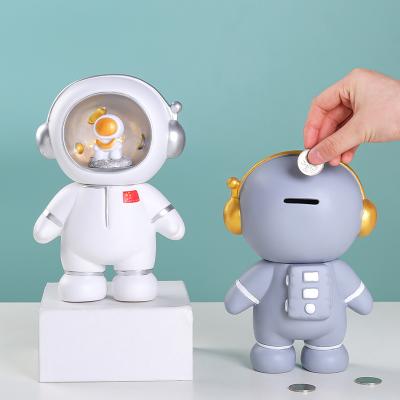 China Eco-friendly material wholesale luminous piggy bank astronaut coin decoration kids room decoration kids gifts for sale