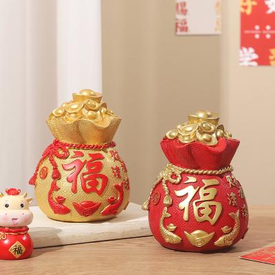 China Modern Home Decoration Crafts Ornaments Lucky Bag Piggy Bank Home Decoration For Living Room Decoration Instruments Resin Home Crafts 2022 for sale