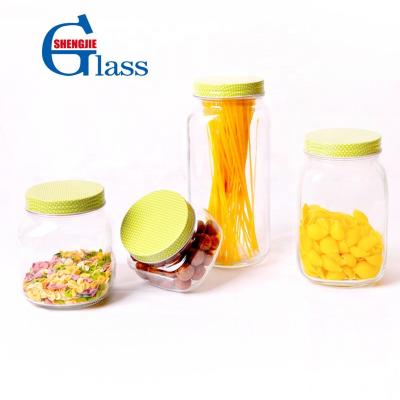 China Transparent Freshness Preservation Storage Jars Design Airtight Glass Seasoning Jars Food Storage Canister With High Tin Lid Light Green for sale