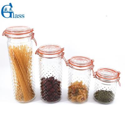 China Wholesale Freshness Preservation Embossed Lid Honey Bottle Glass Storage Jar Honey Jar Food Storage Airtight Honey Glass Jar Metal Locking for sale