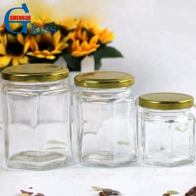 China Freshness Preservation 100ml 200ml 300ml Manufacturer Fancy Storage Bottle Hexagonal Honey Jam Jar Glass With Tinplate Lid for sale