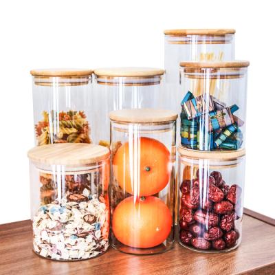 China Borosilicate Glassware Heatable Kitchen Canisters Storage Containers Organizing Jar Lid Bamboo Spice Jars Lid Glass Bamboo Jar Sets for sale