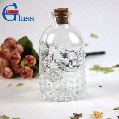 China Scent ; Aroma; Reed; High Transparent Embossed Flower Storage Container Reed Diffuser Perfume Storage Glass Empty Bottle for sale