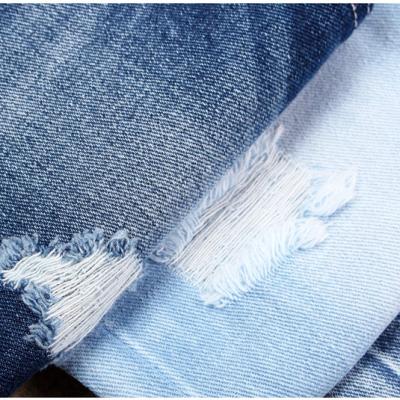 China 100% Shrink-Resistant 100% Cotton Denim Fabric Heavy Duty Jeans Fashion Basic Denim Fabric for sale