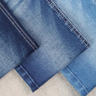 China Dark blue 9OZ stretch jeans fabric at factory wholesale price denim fabrics producing and selling for sale