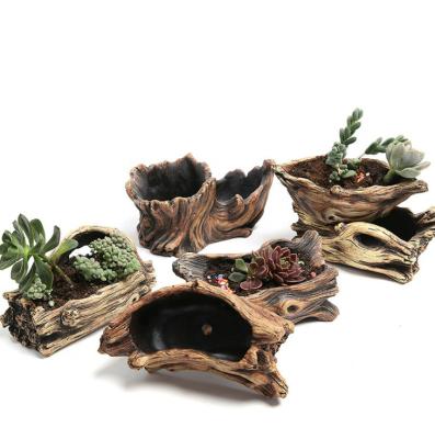 China Creative American Style Cement Tree Root Carving Reusable Mini Pastoral Succulents Basin Planter Stump Flower Pot for sale