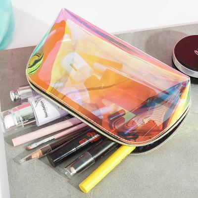 China Shell Hand Makeup Cosmetic Case Laser Clear Eco-friendly Korean Cosmetic Bag PVC Transparent Bag for sale