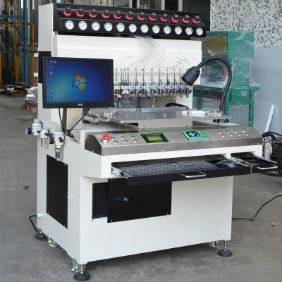 China Full iron body 25000 pcs /day Weldo 12 colors soft Rubber PVC patch /Label Automatic Dispensing/Making Machine for sale