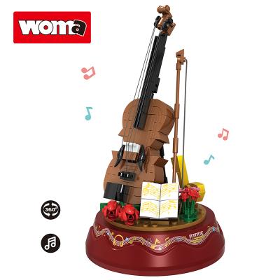 China Building Toy WOMA PLAYS Girl Christmas Gifts Turn Play Music Box Violin Plastic Model Building Block Educational Bricks Toys for sale