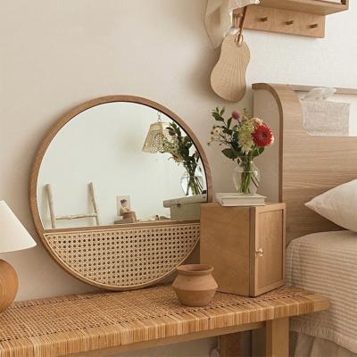 China Wholesale Minimalist Nordic Wind Rattan Mirror Bedroom Handmade Retro Art Home Stay Makeup Mirror Wall Hanging Solid Wood Mirror for sale