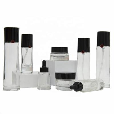 China Black Cosmetic Bottle Set 30g 50g 30ml 35ml 100ml 120ml 150ml Lotion Bottle Glass Jar Cosmetic Black Custom for sale