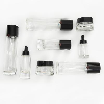 China 30g 50g 30ml 35ml 100ml 120ml 150ml Cosmetic Black Lotion Glass Bottle And Cosmetic Jar For Cosmetic Packaging Kit for sale