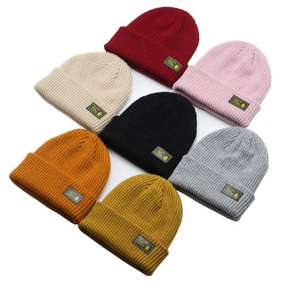 China Factory Promotion Cheap Custom Wholesale Plain JOINT Unisex Winter Keep Warm Knit Beanie Hat With Leather Logo for sale