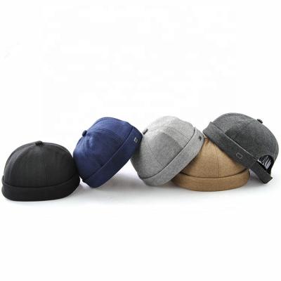 China Hot Selling JOINT JOINT Polyester 6 Panel Beanie Brimless Baseball Hat With Top Button for sale