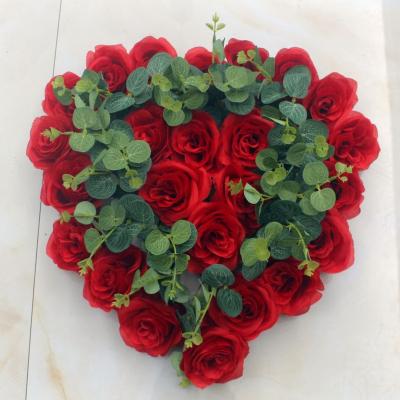 China Artificial Flower Xinghe Heart Shape Artificial Flowers Rose Flower Green Eucalyptus Leaf Wedding Garland Decoration for sale