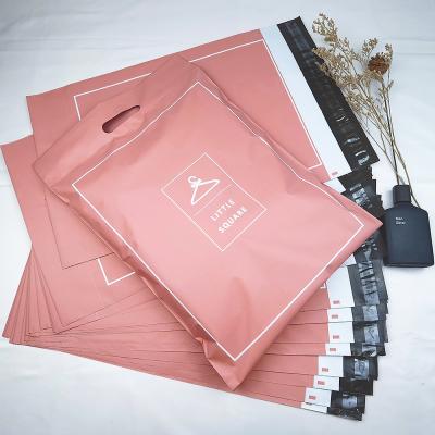 China Poly-Versandtaschen biodegradable and compostable biodegradable custom printed light pink poly envelope mailers plastic mailing bags with handle for sale