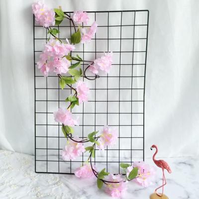 China Modern Artificial Flower Vines Cherry Blossom Artificial Garland For Fence Garden Hedge Decoration for sale