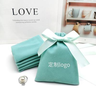 China RuiKaiLi New Product Small Flannel Jewelry Mouth Beam Bag Jewelry Ring Storage Bag Light Green Lipstick Bag Custom Logo for sale