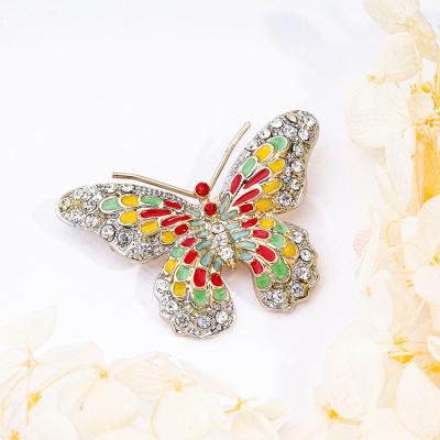 China Custom Anniversary Gold Ribbon Plated Painted Butterfly Brooch Pin for sale