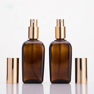 China For Cosmetic Use 100Ml Amber Empty Glass Bottle For Essential Oil With Gold Caps for sale