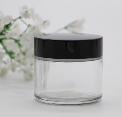 China Personal Care In Stock Clear Color 50ml 2oz Straight Sided Round Glass Cream Jar Candle Jar With Plastic Cap Metal Lid for sale