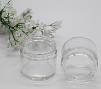 China Personal Care Stored Clear Color 2oz 50ML Straight Sided Round Glass Cream Jar Candle Jar With Black ABS Cover Metal Lid for sale