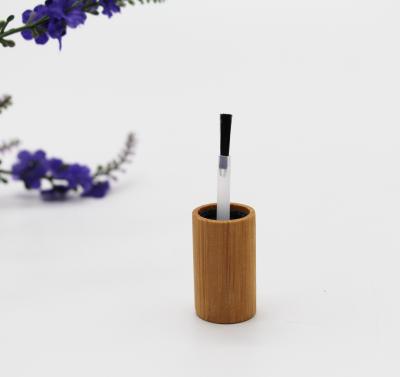 China Non Spill Unique Design Bamboo Wood Cap With Brush For Nail Polish Bottle for sale