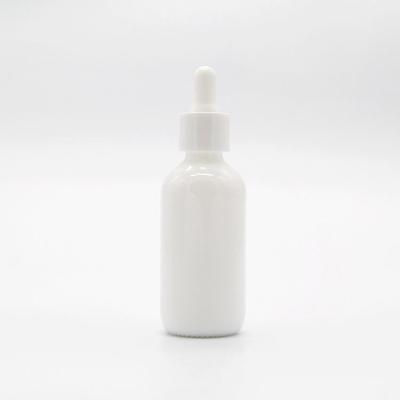 China Personal Care Porcelain Glass White Bottle For Essential Oil And Lotion Packaging for sale