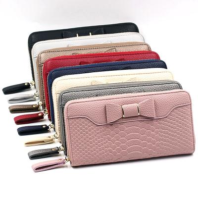 China Multifunctional Wrist Belt Women's Lychee Pink Clutch Bowknot Phone Case Card Holder Leather Wallet for sale