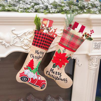 China Red Black Christmas Canvas Decorations Boxcar Flowers Gift Bag Candy Socks Gift Bag Christmas Socks for sale