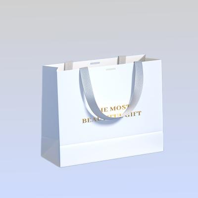 China Recyclable Custom Luxury Clothing Boutique Packaging Personalized Logo Clothing Gift Bags for sale