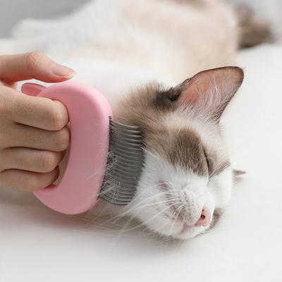 China Dropshipping Viable Pet Massager Brush Removal Comb Shell Shaped Handle Pet Grooming Massager for sale