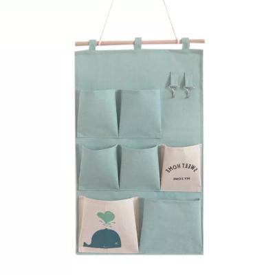 China High Quality Proven Cotton Folding and Canvas Bedside Proven Storage Organizer Bag Wall Hanging Storage Bags for sale