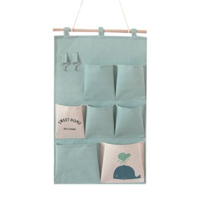 China New Listing Cotton Folding and Multi Pockets Canvas Door Hanging Storage Bag Organizer Bag for sale