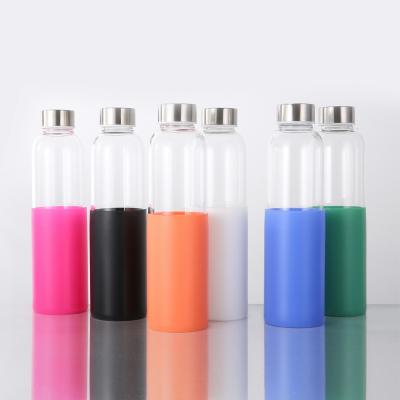 China Amazon Success 600ml High Sustainable Drinking Glass Reusable Water Bottle With Stainless Steel Lid And Silicone Sleeve for sale