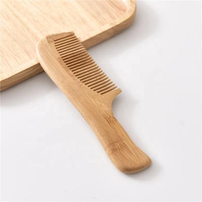 Cina Travel wholesale handmade wooden bamboo comb wide and dense natural static wooden comb in vendita