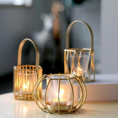 China Creative Gold Light Luxury Metal Candle Holder Pumpkin Lantern Modern Candle Cup Cavity Jar Candle Ornaments for sale