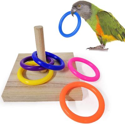 China Viable Wooden Tower Table Parrot Toys Bird Toy Parakeet Educational Foot Toys Educational With Stacking Color Ring for sale