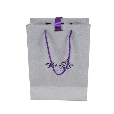 China Promotion Customized Logo Glitter Paper Bag Silvery Purple Gift Bags With Purple Handle for sale