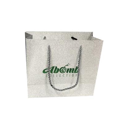 China Promotion Custom Logo Silver Paper Bags Glitter Paper Bags Packing Apparel Shipping Bags for sale