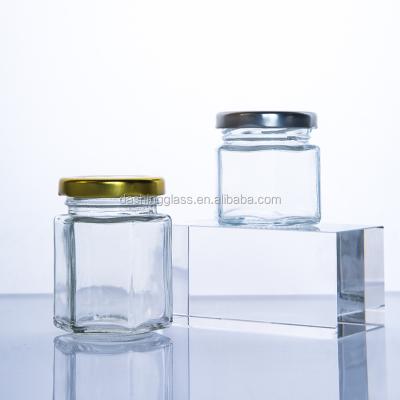 China Sustainable Wholesale Clear Hexagon Shaped Airtight Glass Storage Jar With Metal Lid for sale