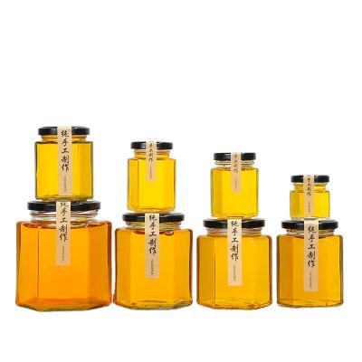 China Sustainable Wholesale Clear Hexagon Jam Glass Jar With Metal Lid for sale