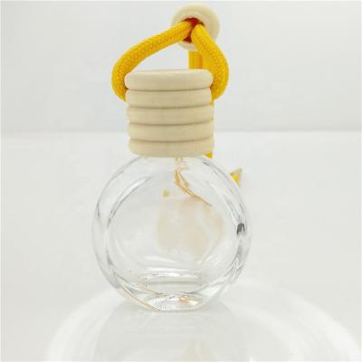 China Wholesale Empty Round Car Personal Care Perfume Diffuser Simple Design Car Hanging Perfume Bottle for sale