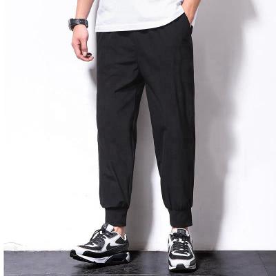 China Anti-pilling Autumn New Sport Leisure Fitness Pants Jogging Sweatpants Small Foot Training Zipper Pockets Patchwork Trousers for sale